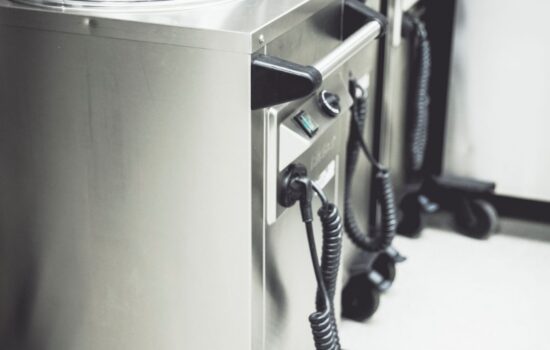 heated plate dispenser with plastic hygiene covers lined up for service